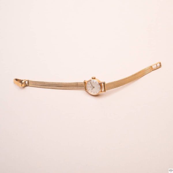 Montre de dame vintage Omega en or jaune bracelet maille